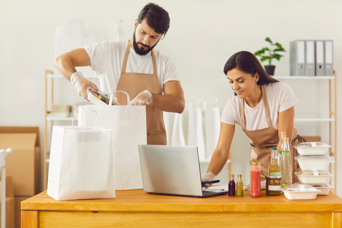 Workers of Food Delivery Service Packing Boxed Takeaway Food and Accepting Online Orders
